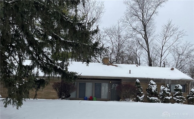 view of snow covered property