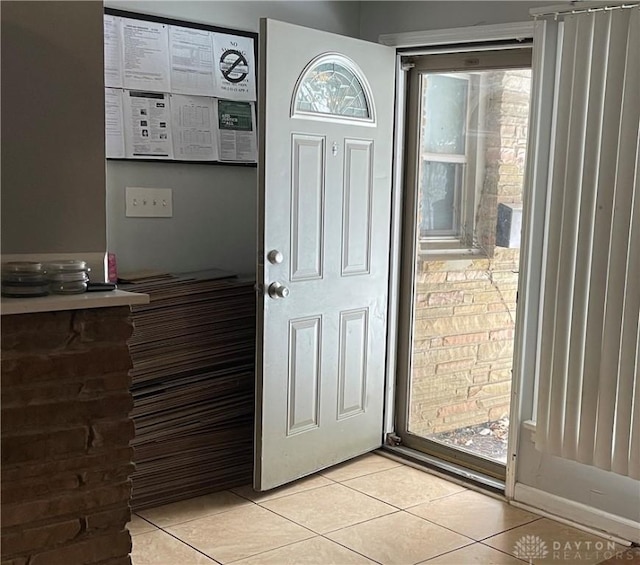 foyer entrance featuring light tile patterned floors