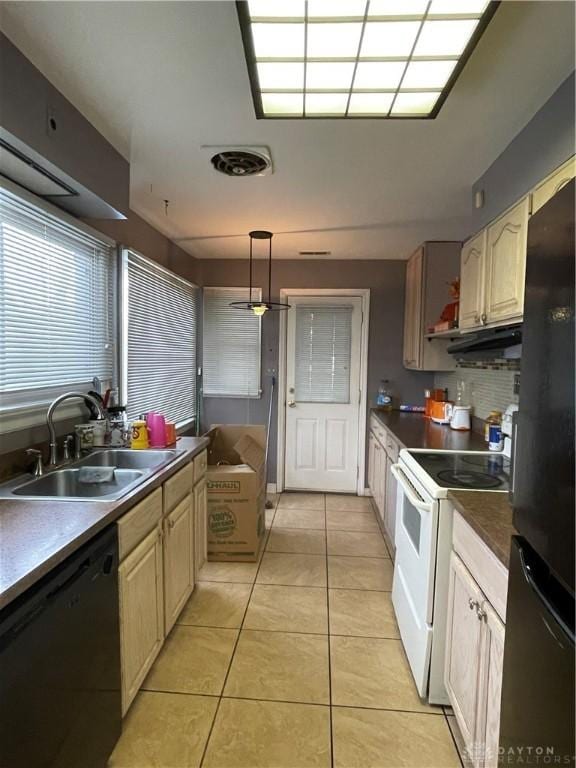 kitchen with light tile patterned flooring, decorative light fixtures, sink, black appliances, and light brown cabinets