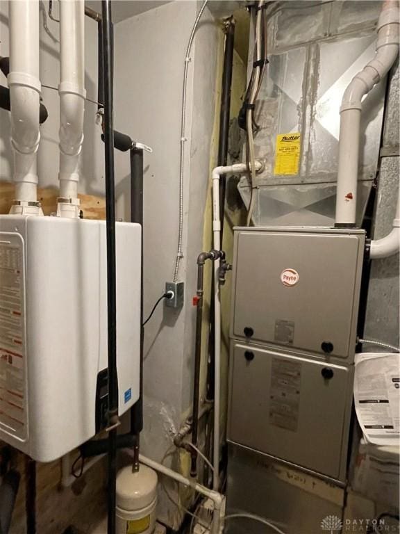 utility room with water heater