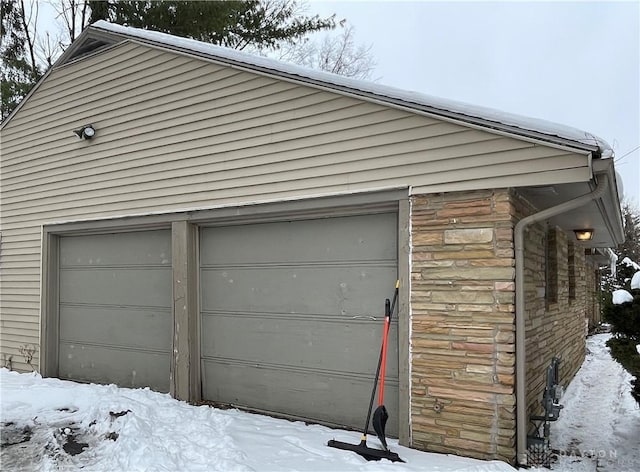 view of snow covered garage