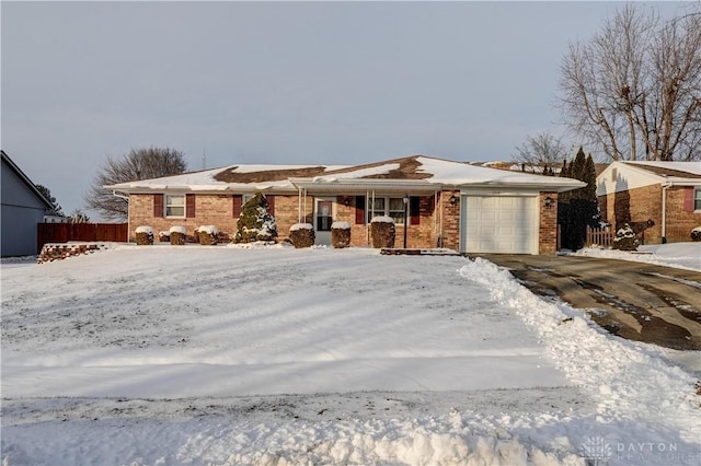 ranch-style house featuring a garage