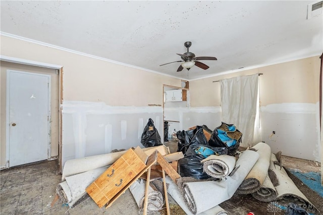 interior space with ceiling fan and ornamental molding