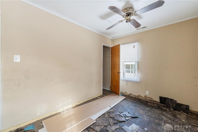 unfurnished room with ceiling fan and crown molding