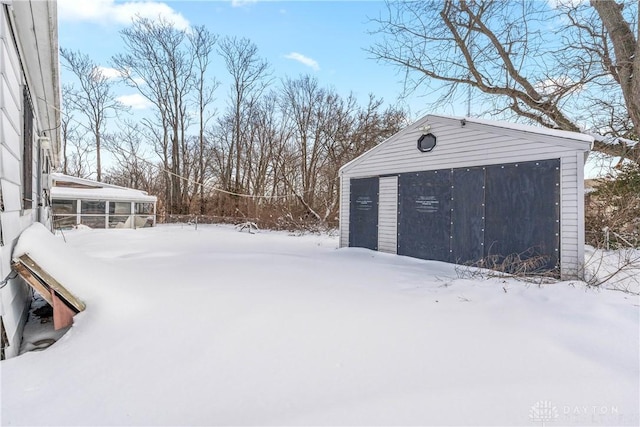 view of snow covered garage