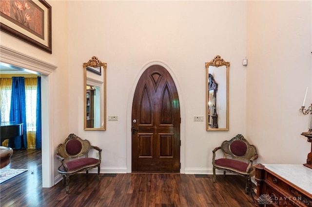 foyer with dark hardwood / wood-style flooring