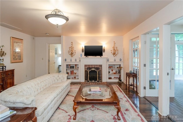 living room featuring a fireplace and wood-type flooring