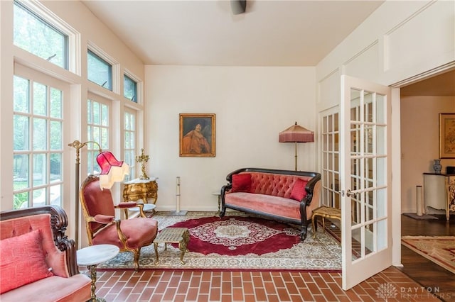 living area featuring french doors and plenty of natural light