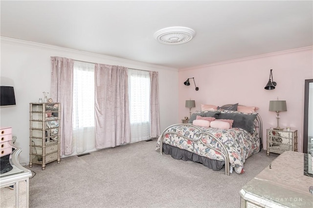 bedroom with carpet floors and ornamental molding