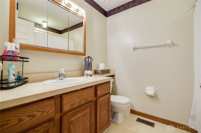 bathroom featuring a shower with curtain, tile patterned floors, toilet, and vanity