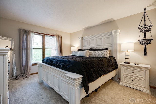 bedroom with light colored carpet