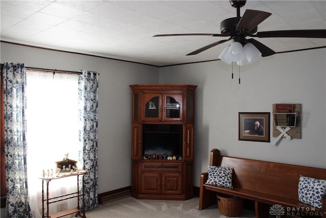 living area featuring ceiling fan and light colored carpet