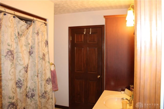 bathroom featuring vanity and walk in shower