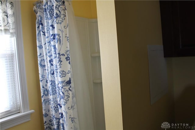 bathroom with a shower with curtain