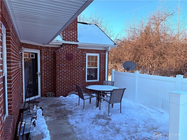 view of snow covered patio