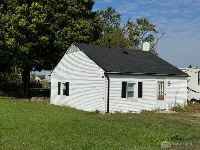 view of property exterior with a yard