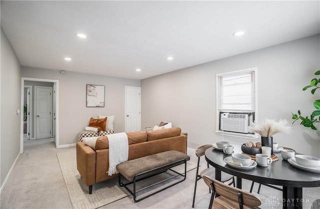 living room featuring light carpet and cooling unit