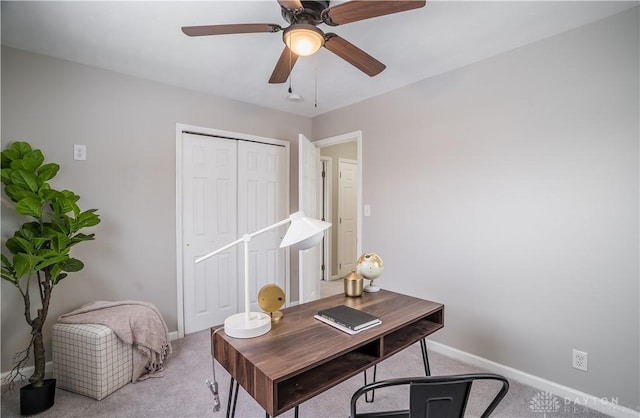 carpeted office with ceiling fan