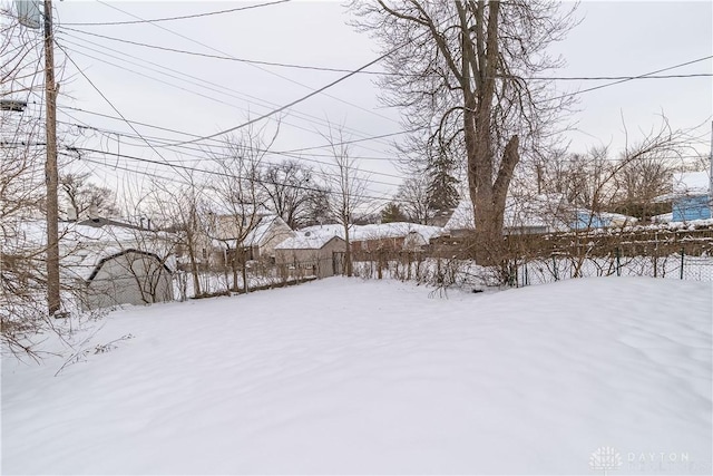 view of yard layered in snow