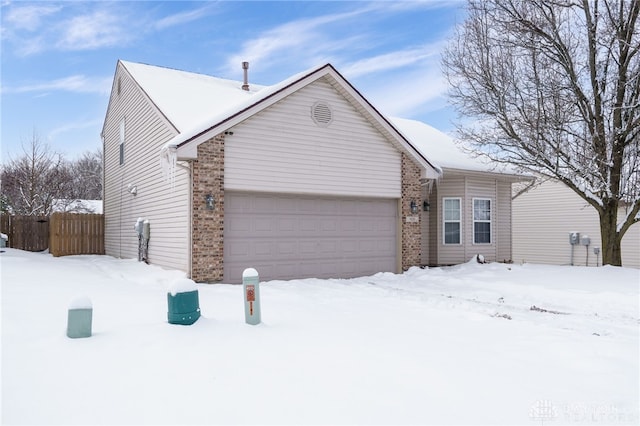 single story home featuring a garage