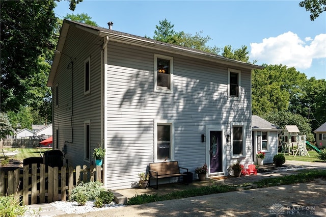 view of front of home featuring a playground