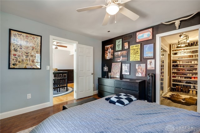 bedroom featuring dark hardwood / wood-style flooring and ceiling fan