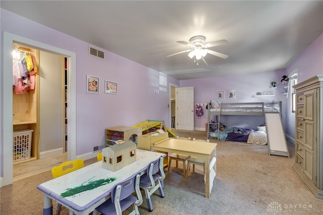 interior space with ceiling fan