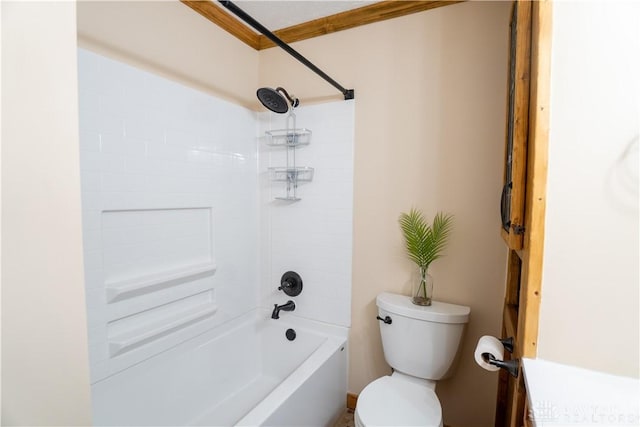 bathroom featuring toilet, bathing tub / shower combination, and ornamental molding