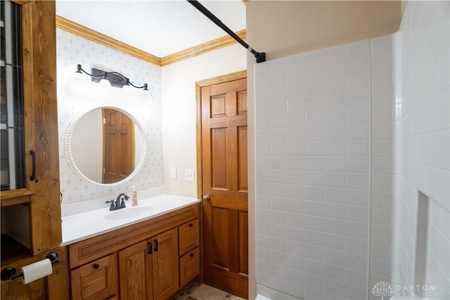 bathroom with crown molding and vanity