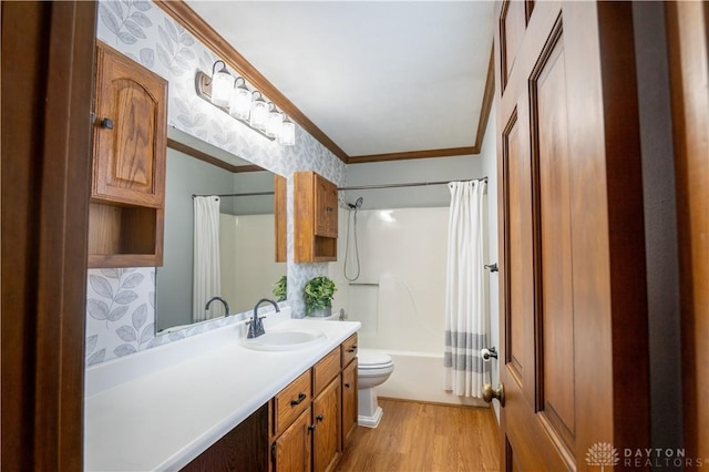 full bathroom with hardwood / wood-style floors, shower / bath combination with curtain, ornamental molding, vanity, and toilet