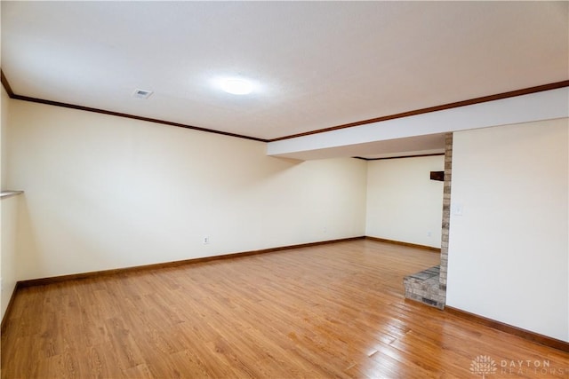 interior space featuring hardwood / wood-style floors and ornamental molding