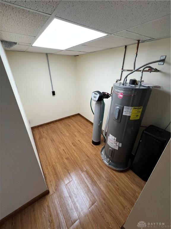 utility room featuring water heater