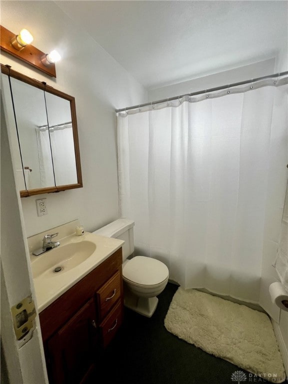 bathroom featuring vanity and toilet