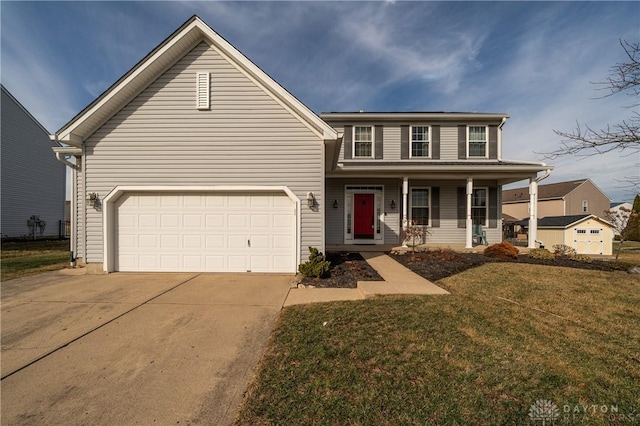 view of front of property featuring a garage, a front yard, and a porch