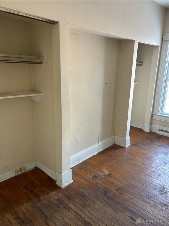 unfurnished bedroom featuring dark hardwood / wood-style floors