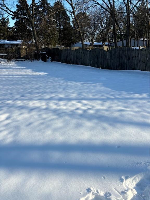 view of yard layered in snow