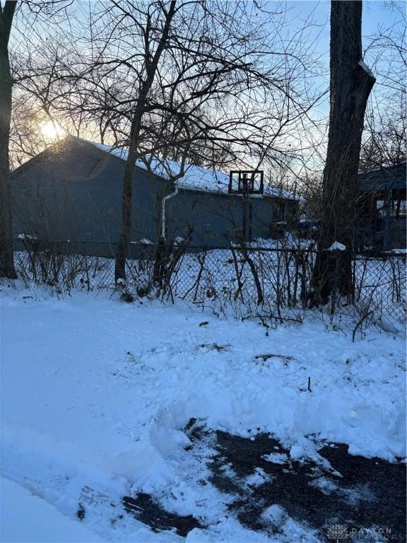 view of yard layered in snow