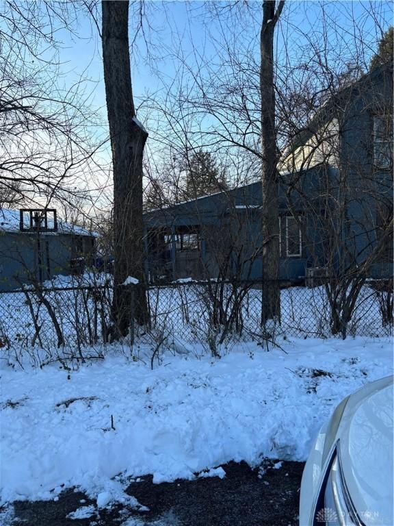 view of yard layered in snow