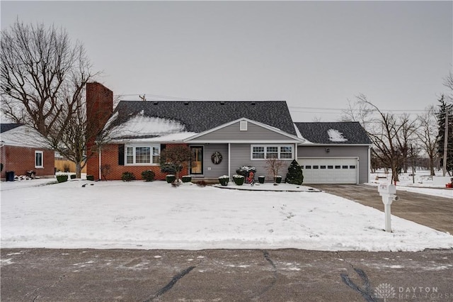 ranch-style home featuring a garage