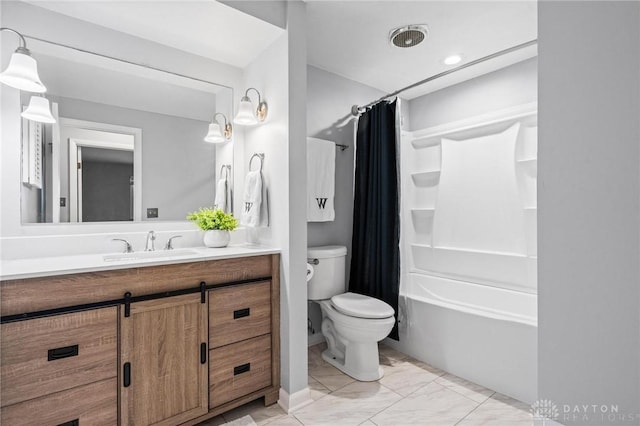 full bathroom with vanity, shower / bath combo, and toilet