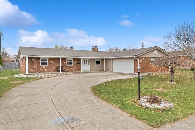 single story home with a front lawn and a garage