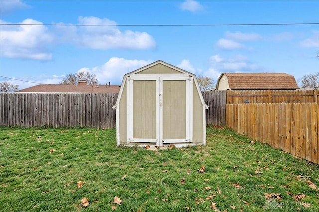 view of outdoor structure with a lawn