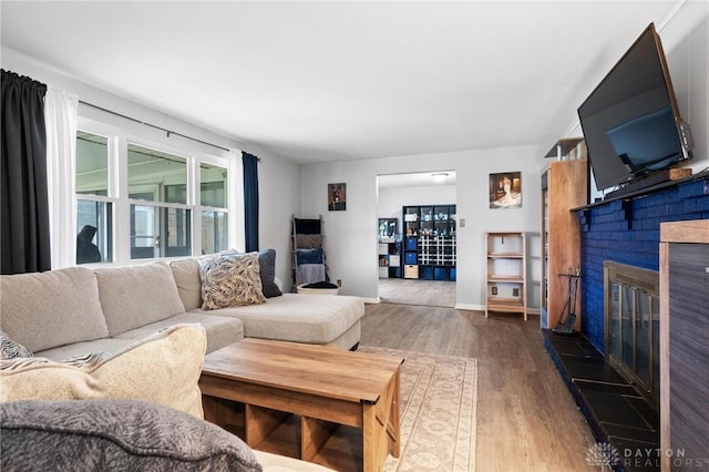 living room featuring hardwood / wood-style floors and a fireplace