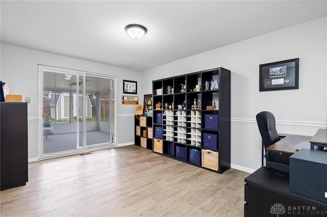 home office featuring hardwood / wood-style floors