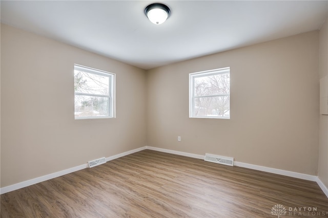 spare room featuring hardwood / wood-style flooring