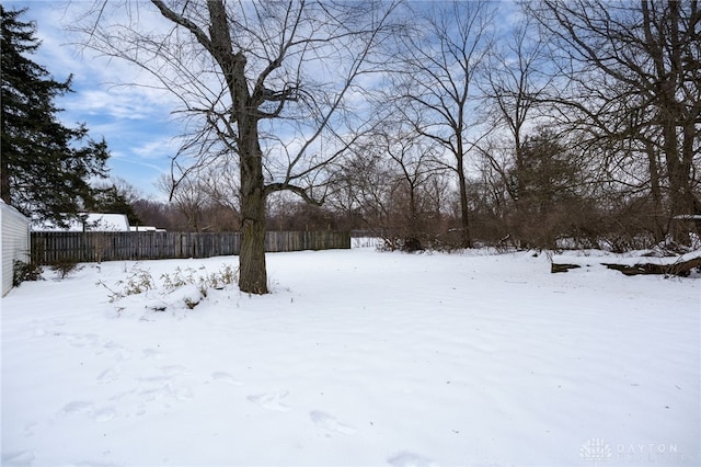 view of yard layered in snow