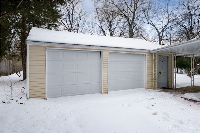 view of snow covered garage