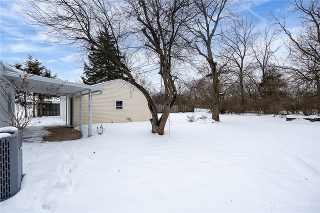 yard covered in snow featuring central air condition unit