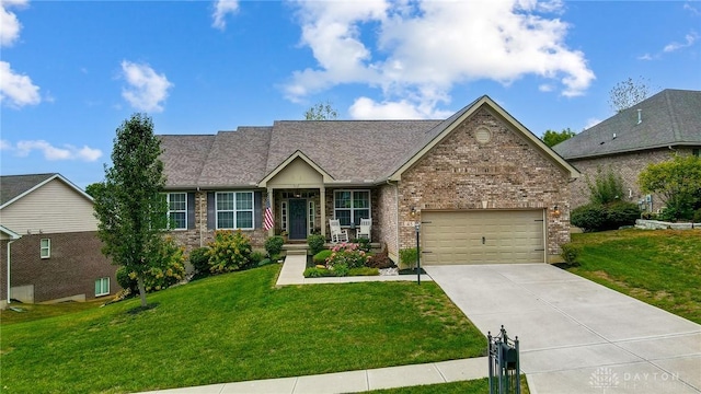 view of front of home featuring a garage and a front lawn