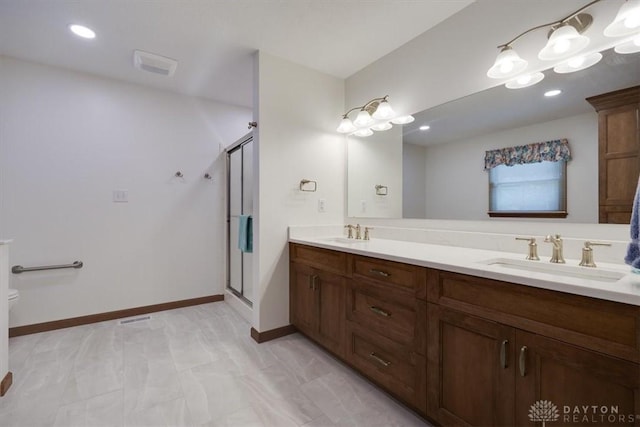 bathroom featuring vanity and walk in shower